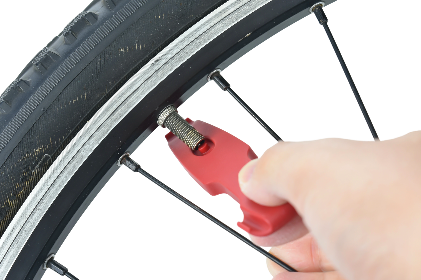 Bicycle tyre removal demonstration with the red tyre lever at the rim